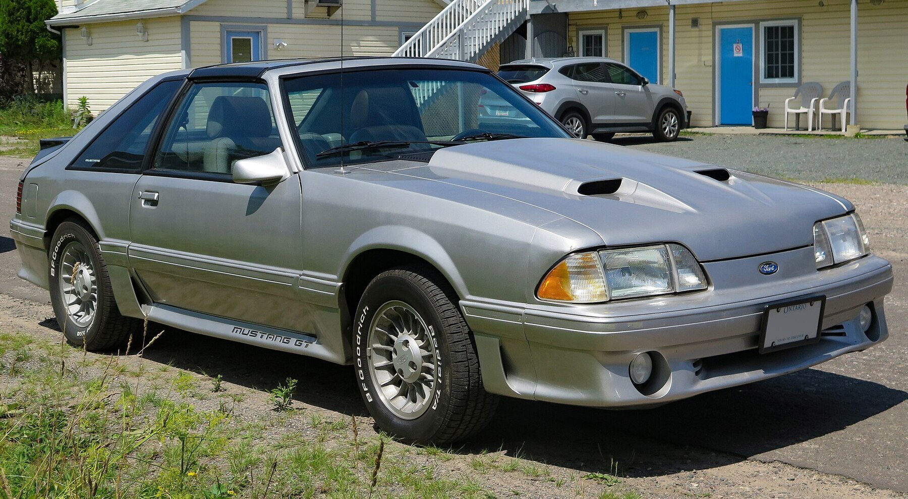 1987 Ford Mustang Cobra GT 2-Door Hatchback in Light Gray, Front Right (Hilton Beach 2023)