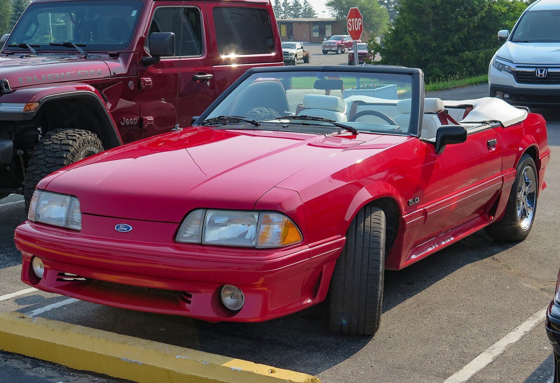 1991 Ford Mustang GT Convertible in Bright Red, Front Left (St. Ignace 2023)